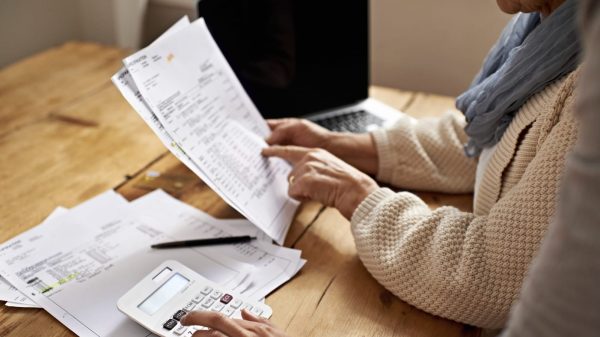 Couple Examining Medical Billing Statement Stock Photo