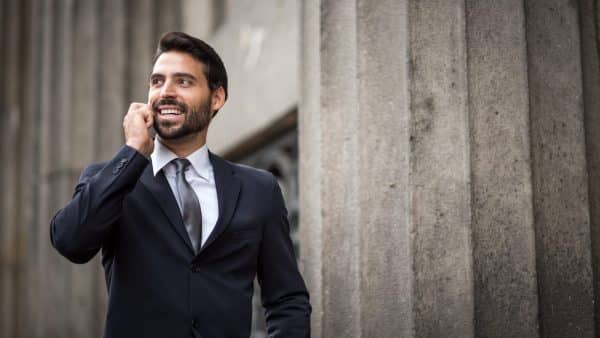 Personal Injury Lawyer Talking On A Smart Phone Stock Photo